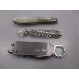 A trio of unusual pocket knives, the first in silver with two blades, detachable yale key and