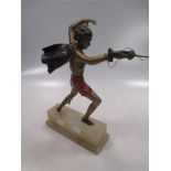 An early 20th century cold painted spelter figure of a fencer with sword and cape
