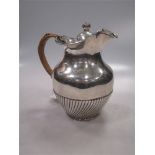 A Victorian silver hot water jug