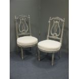 A pair of Louis XVI painted salon chairs, with lyre backs