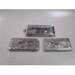 An Irish silver card case, together with a silver card case in the form of an envelope and a