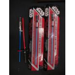 Two Star Wars Replica light sabres, with boxes, and two others