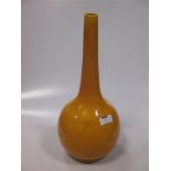 A Burmantofts yellow glazed bottle vase