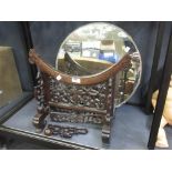 A Chinese hardwood mirror stand with a late mirror plate