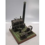 A Bing miniature tinplate Steam stationary engine on a tiled wooden base, with instructions (lacking