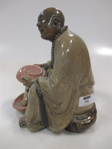 An early 20th century Chinese stoneware figure of a seated man - Image 2 of 6