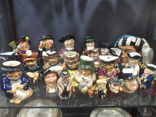 A collection of character jugs including Doulton
