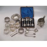 A collection of silverware,
