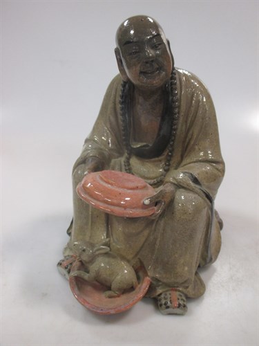 An early 20th century Chinese stoneware figure of a seated man