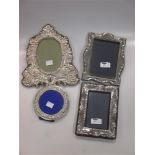 A collection of 4 silver fronted photograph frames