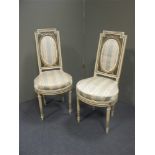 A pair of painted frame open armchairs, in Louis XVI style