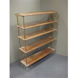 A mahogany open front bookcase, with brass gallery and cushion supports, 101cm wide