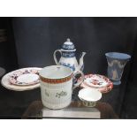 An early 19th century pearlware mug with diaper leaf and berry border moulded bands and painted with