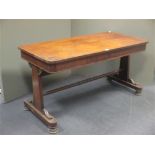 A 19th century rosewood two drawer library table 70 x 138 x 66cm