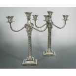 A pair of Victorian silver three light metamorphic candelabra,