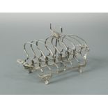 A George III silver toast rack by William Bateman,