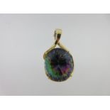 A pendant set with an oval 'mystic' quartz,