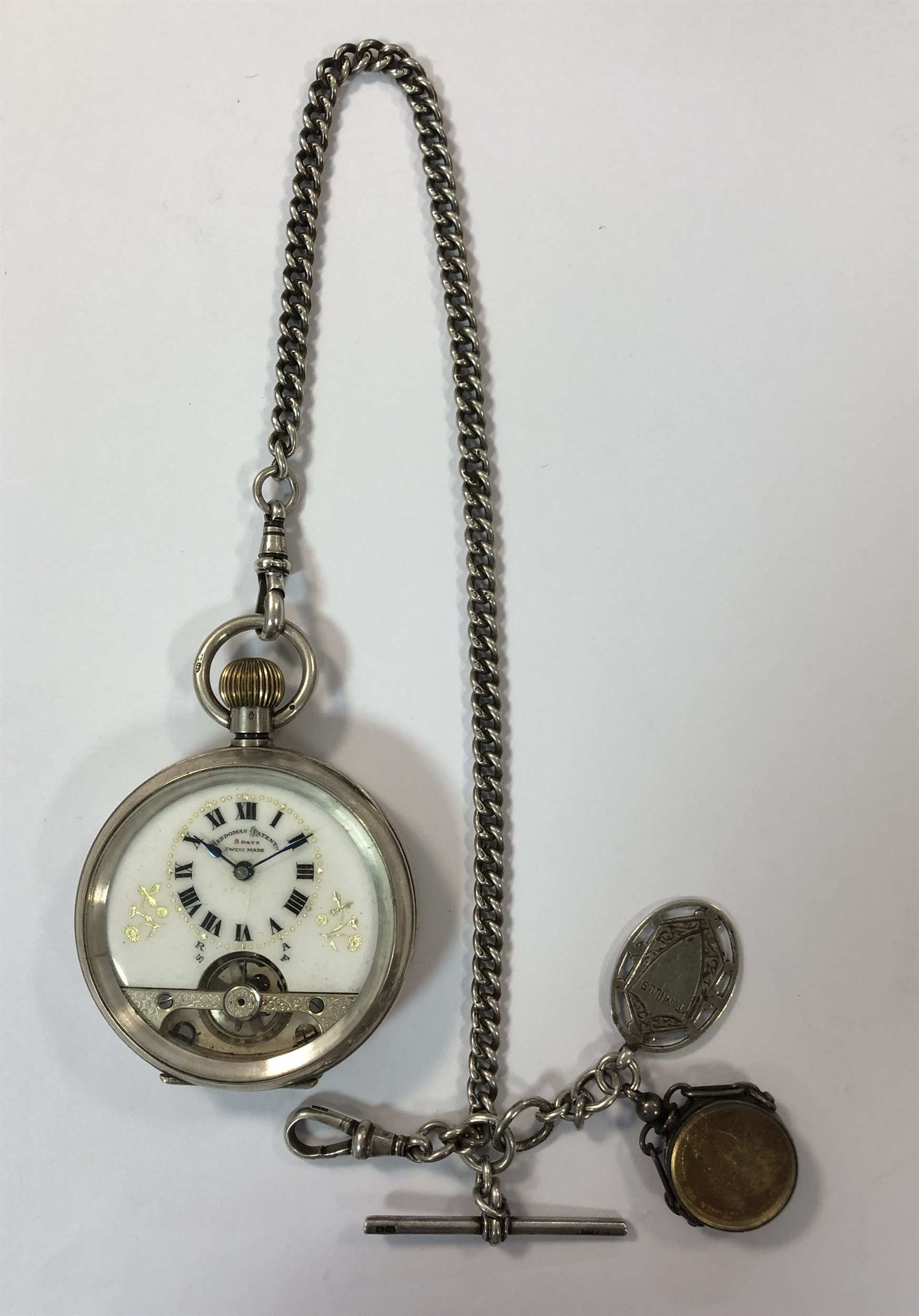 Schild & Cie - A George V silver Hebdomas 8 day open faced pocket watch and chain,