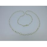 A necklace of spectacle set moonstones,