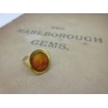 A carved cornelian intaglio ring, probably Roman,