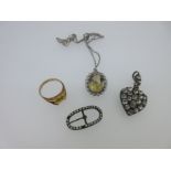 A vintage paste set heart pendant, a citrine pendant and two other citrine or paste pieces,