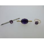 An antique amethyst brooch and two other purple hardstone jewels,