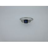 A sapphire and diamond three stone ring,