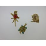 A trio of novelty animal brooches,