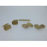Two pairs of 9ct gold cufflinks and a tie pin,