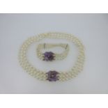 A cultured pearl choker and bracelet suite with amethyst and diamond four-leafed clover clasps,