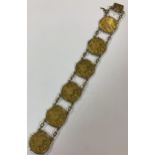 A bracelet set with six Austrian one ducat gold coins,