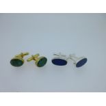 A pair of single ended emerald cufflinks and a similar pair set with lapis lazuli,