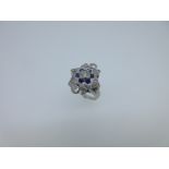 A diamond and sapphire star ring,