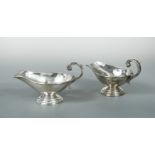 A pair of continental metalwares sauce boats,