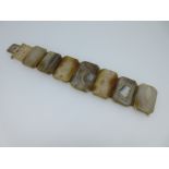 A panel bracelet of banded and spotted agates,