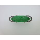 An Art Deco carved jade plaque and diamond brooch,