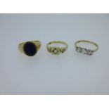 Three diamond or gemset rings testing for 18ct gold,