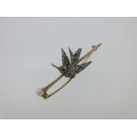A diamond set hummingbird brooch,