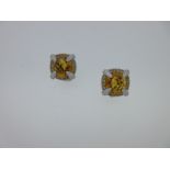 Rodney Rayner - A pair of 18ct gold diamond and citrine set earclips,