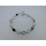 A modern moonstone and multi gem set bracelet,