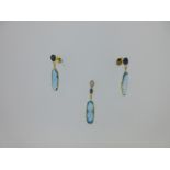 A blue topaz and sapphire earring and pendant suite,