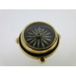 A gimbal compass pendant,