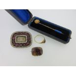 A Georgian garnet and seed pearl brooch together with three other antique items of jewellery,