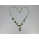 A necklace set with pear cut prasiolites,