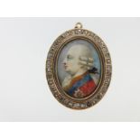 A George III miniature set as a pendant with hairwork back,