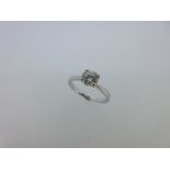 A single stone diamond ring set in platinum,