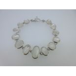 A modern bracelet set with moonstones,