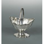 A George III silver swing handled sugar basket,