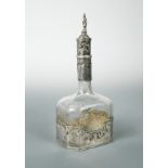 A late 19th century Dutch metalwares silver and glass decanter,