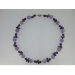 An amethyst and iolite bead necklace,